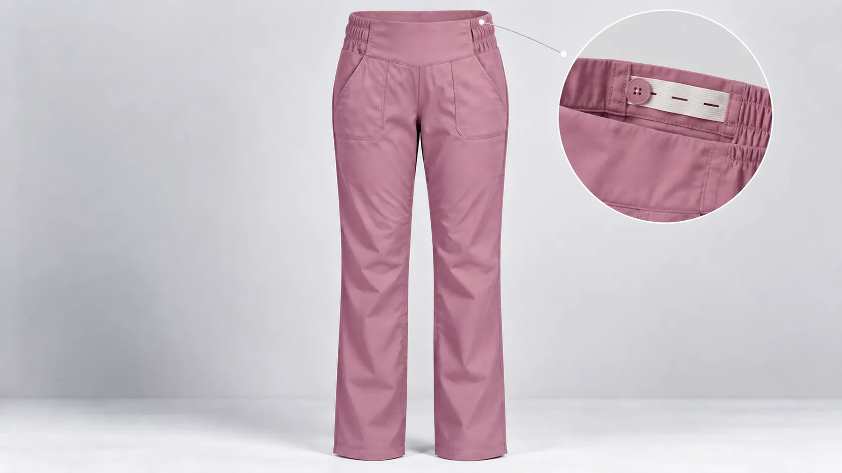 Pink maternity scrub pants with front pockets and an adjustable button-and-elastic waistband.