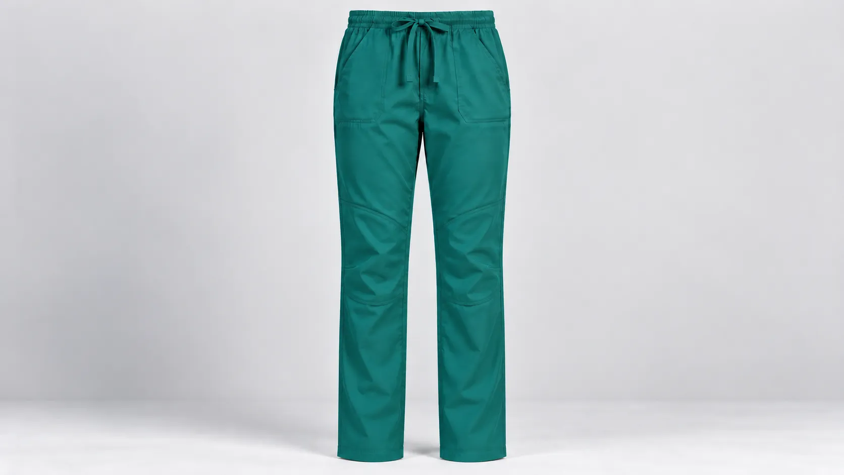 Teal straight-leg scrub pants featuring shaped knee panels, an elastic drawstring waist and front pockets.