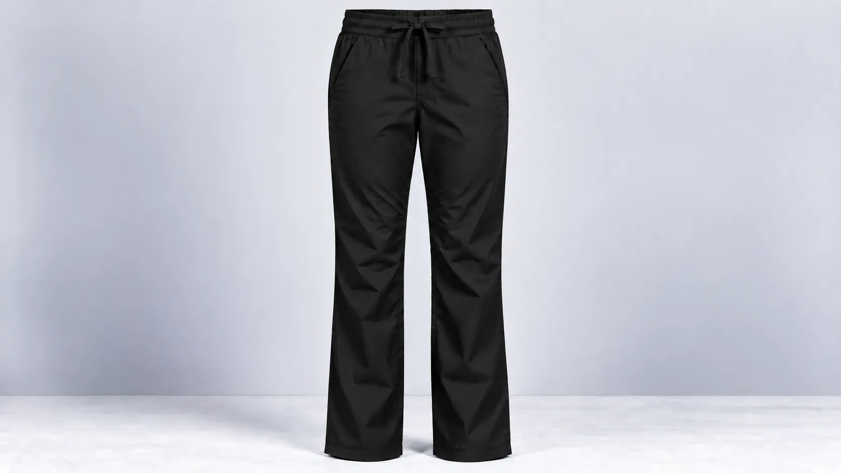 Black straight-leg scrub pants with an elastic drawstring waistband and front side pockets.