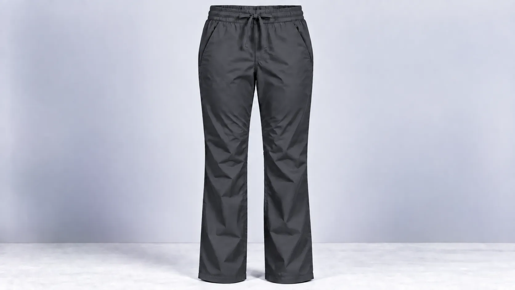 Charcoal scrub pants featuring straight legs, an adjustable drawstring waist and two side pockets.