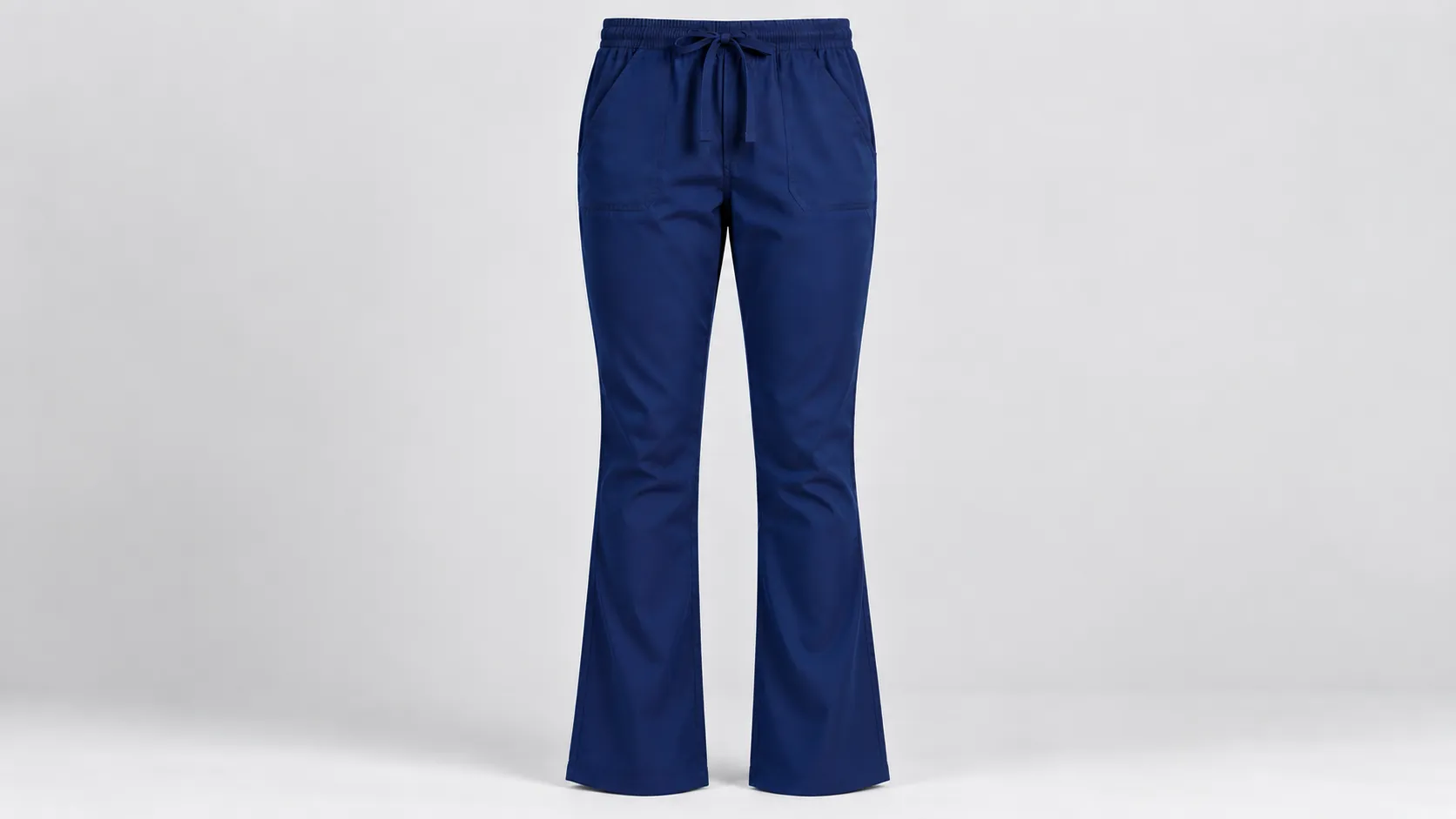 Navy bootcut scrub pants with a drawstring waistband, front pockets and a gently flared leg.