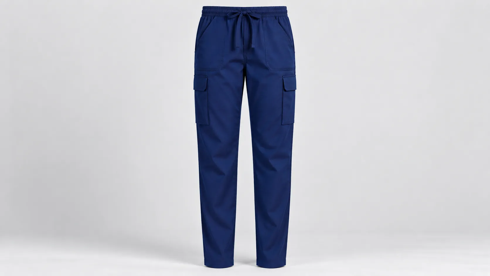 Navy scrub cargo pants featuring an elastic drawstring waist and spacious utility pockets on each leg.