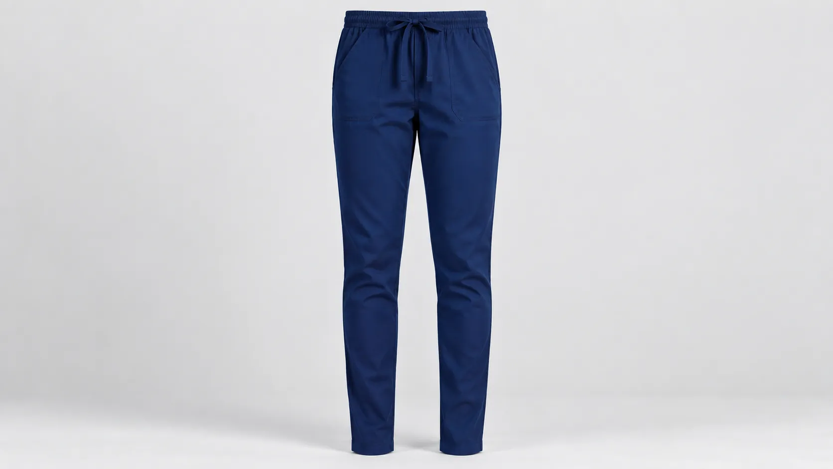 Navy scrub pants featuring a slim silhouette, adjustable drawstring waist and practical front pockets.
