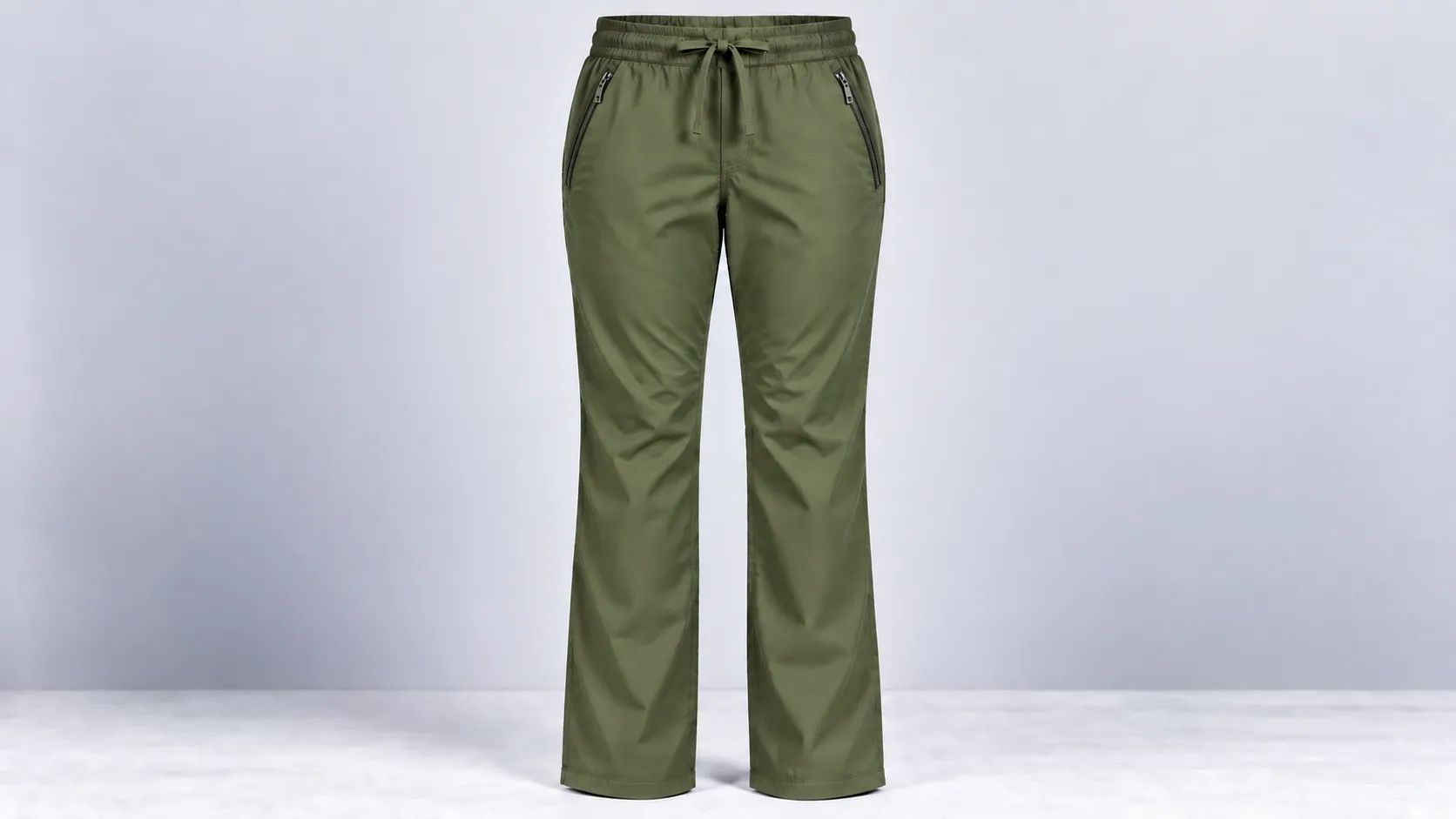 Olive scrub pants featuring secure zippered hip pockets, a drawstring waist and straight-leg design.