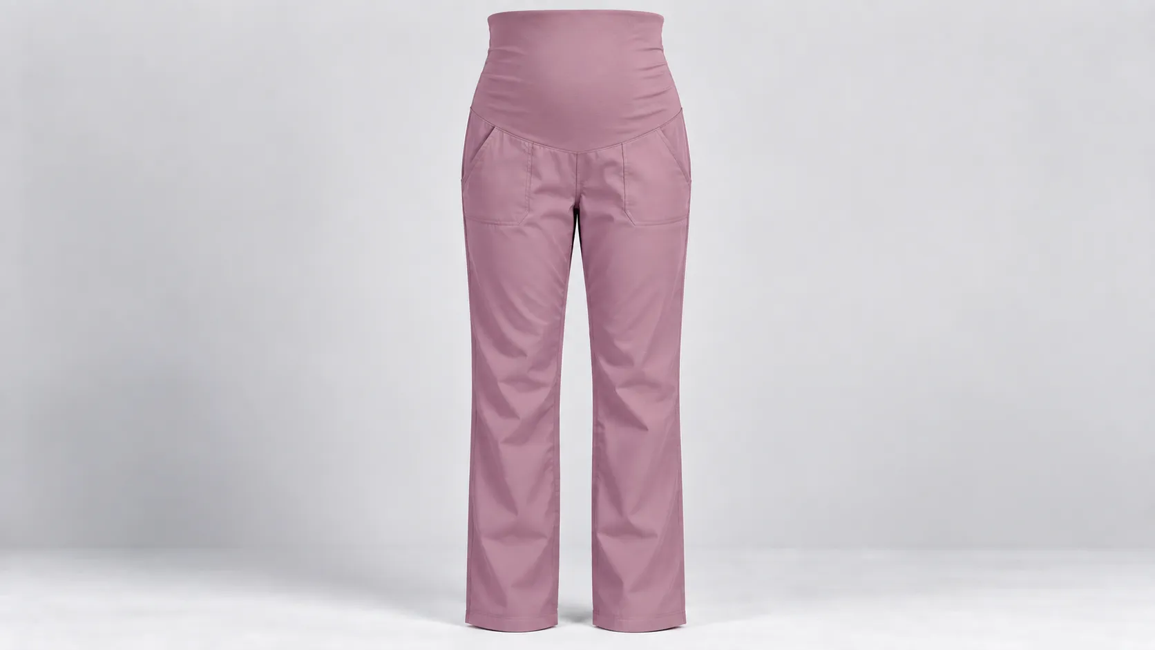 Pink maternity scrub pants with a high over-bump stretch waistband, front pockets and straight legs.