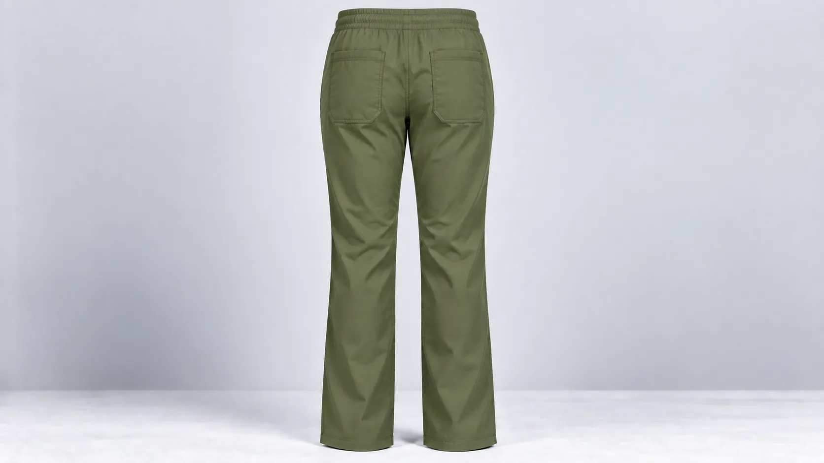Back view of olive green scrub pants with an elastic waistband and two large patch pockets.
