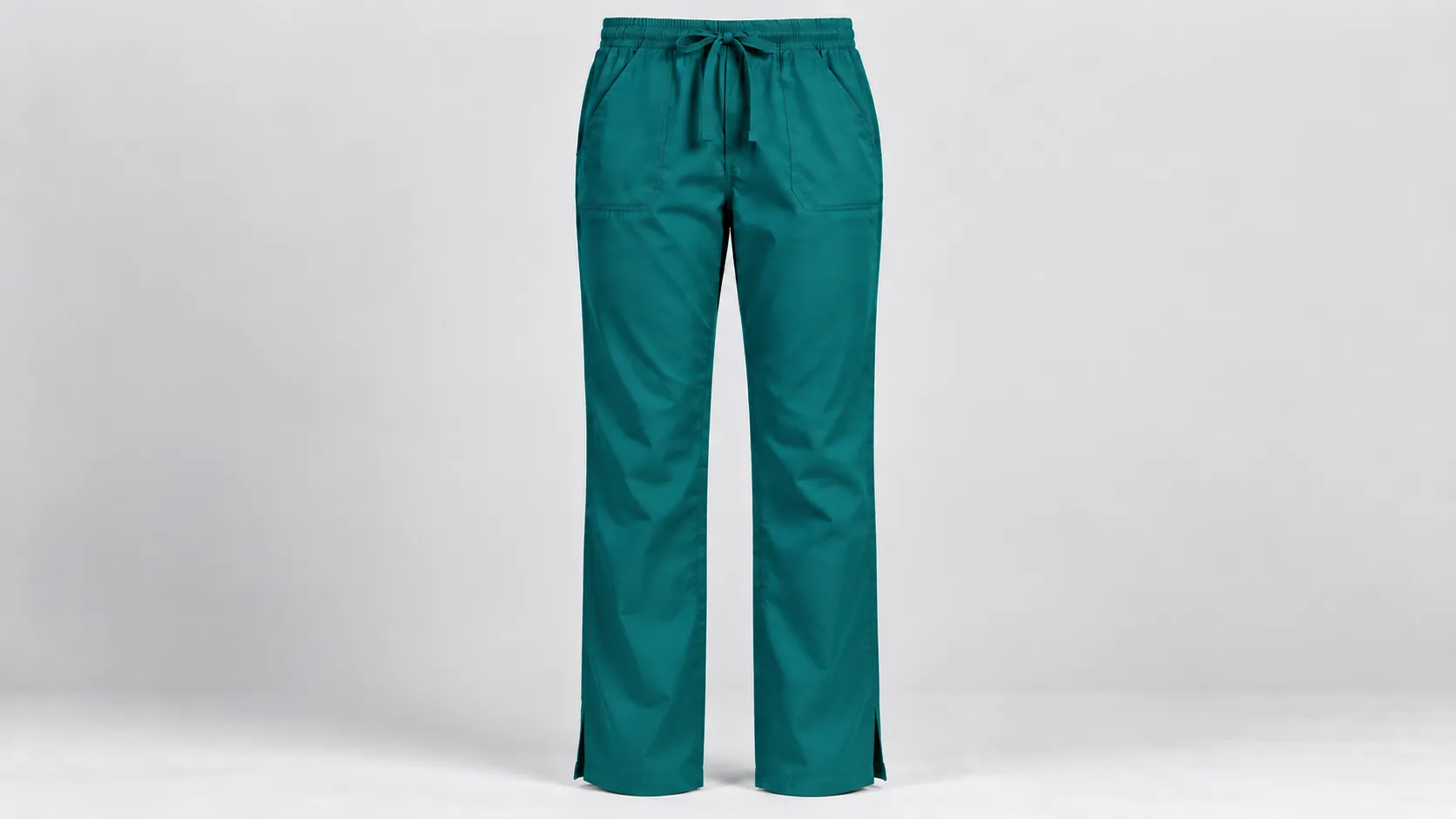 Teal straight-leg scrub pants with side slits at the hems, drawstring waist and front pockets.