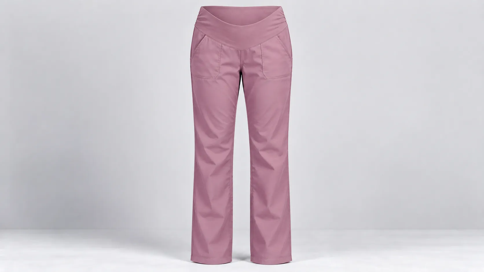 Pink straight-leg maternity scrub pants featuring a low under-bump stretch waist and two front pockets.